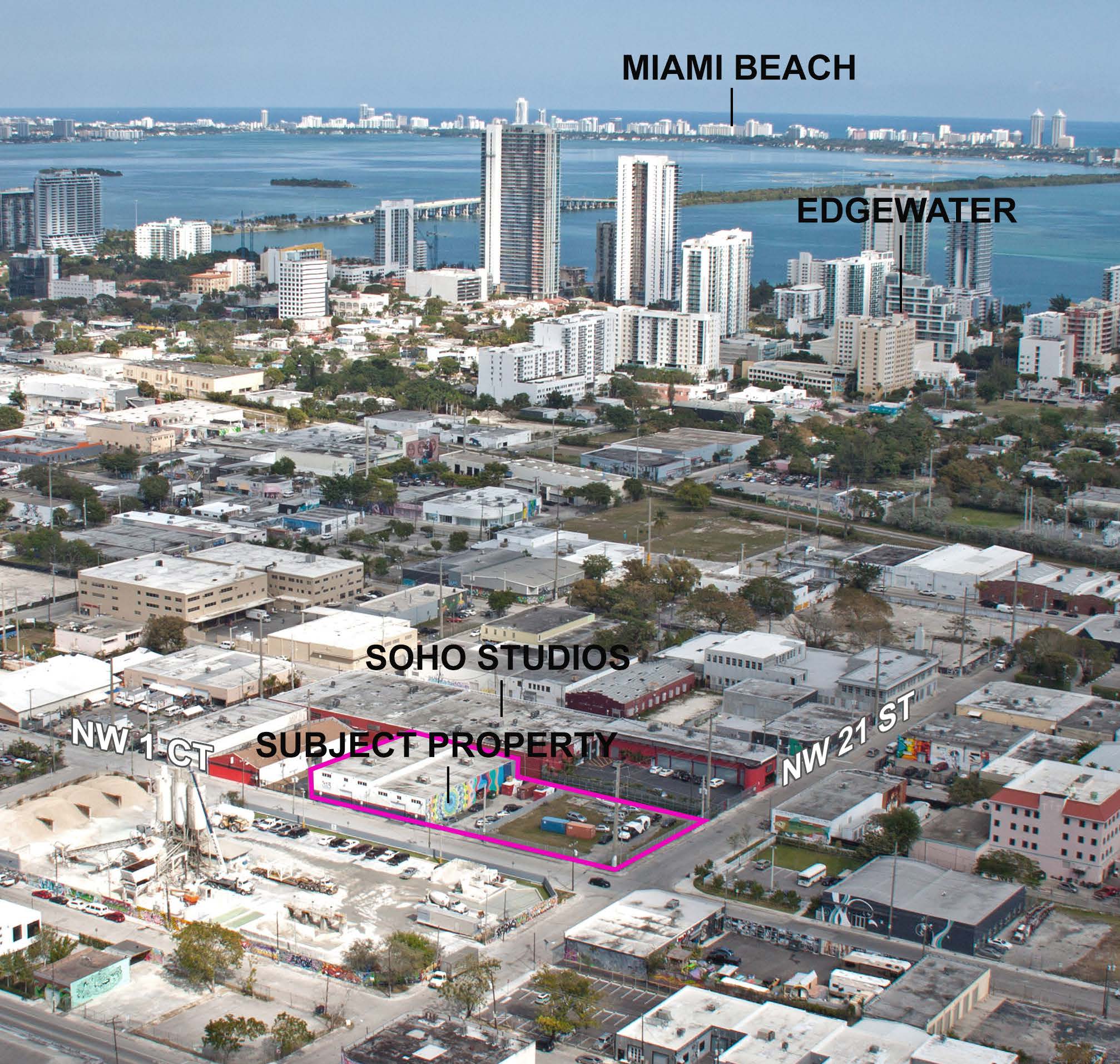 The property outlined on its block, with the Miami skyline behind